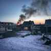 gray wooden house burning